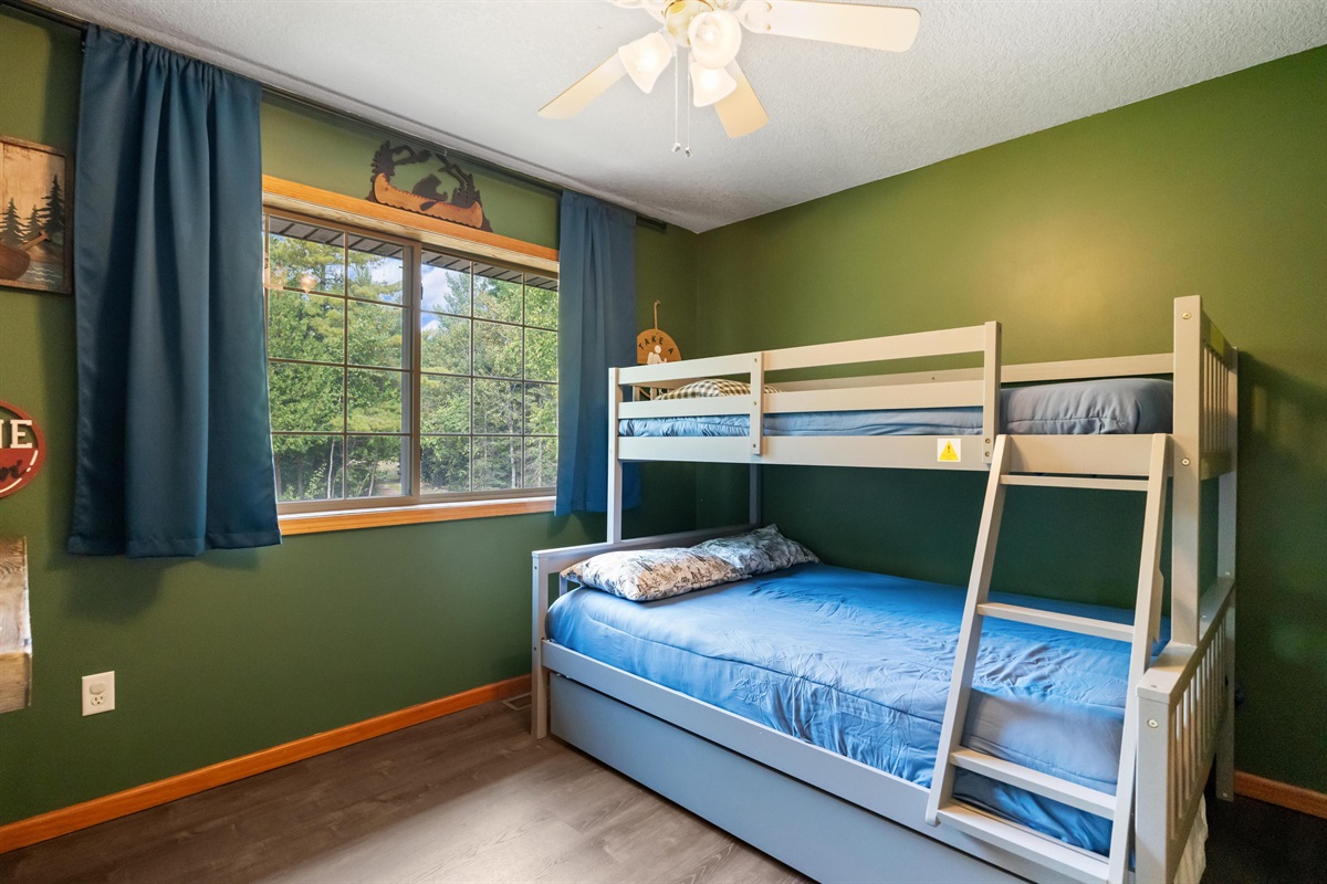 Kids bunk room Twin over full sized bunk bed with twin sized trundle- Top bunks will have the clean bedding folded and laid on top of them due to cleaning team requirements