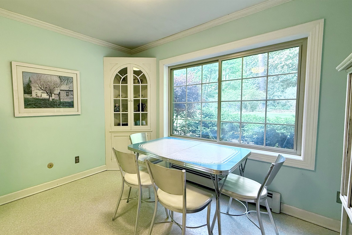Cozy dining nook by the window with seating for four