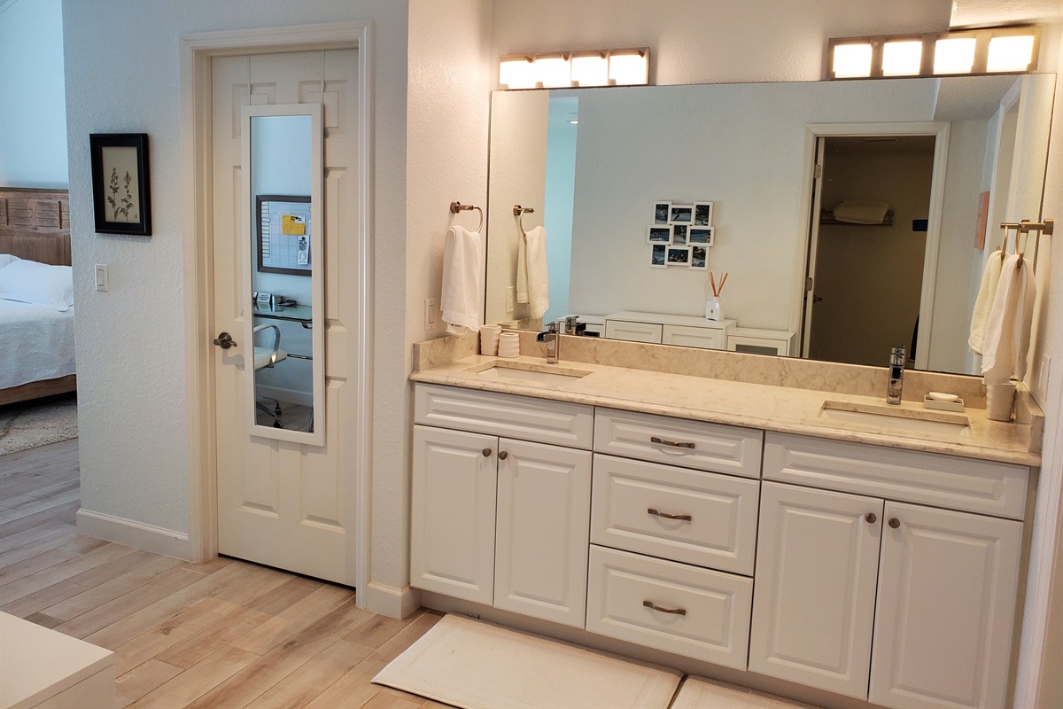 Master private bathroom with large closet and double sinks.