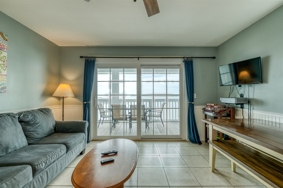 Living area has large sliding glass doors that lead to the porch