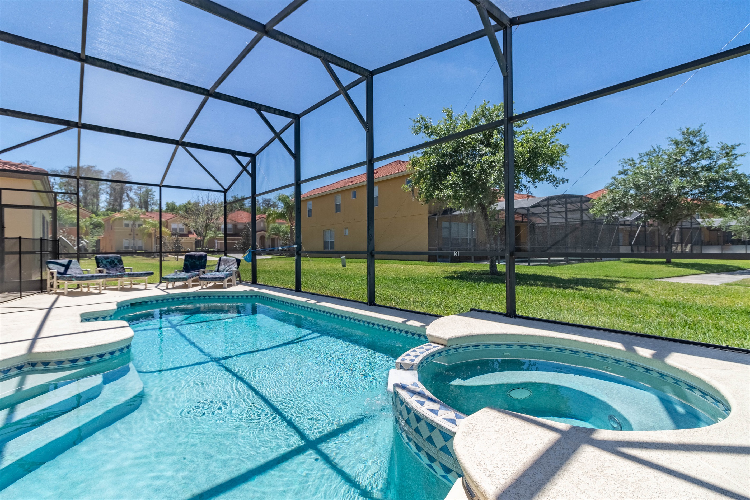 Private screened pool and spa in a secure gated resort, ideal for relaxing after visiting the parks