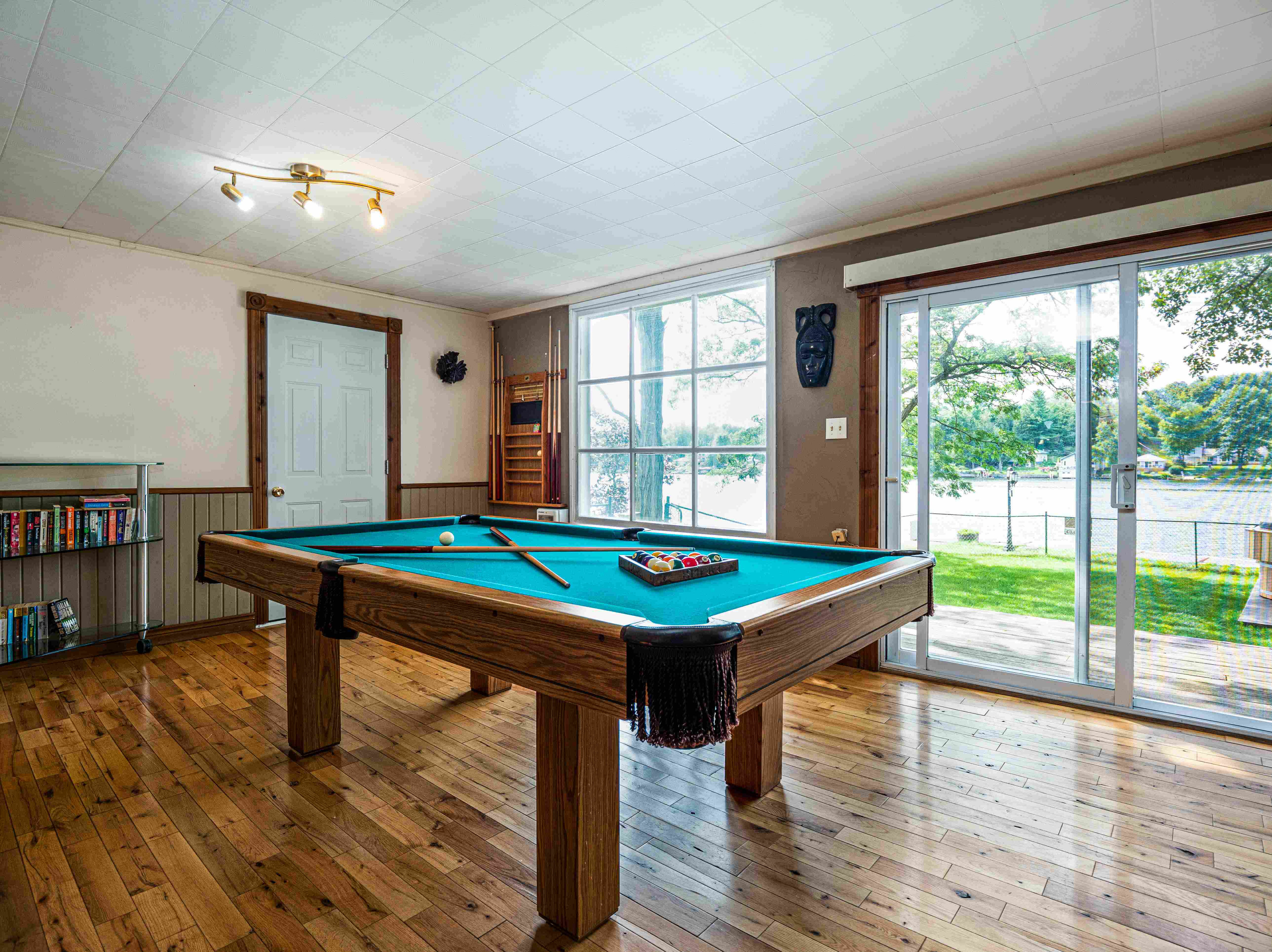 Recreation area with pool table and large windows