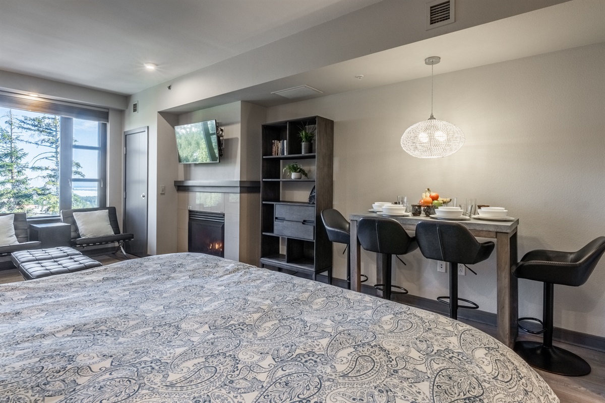 The sleeping area flows naturally into the living space, making the studio feel spacious, relaxed, and easy to settle into and reinforcing the studio's smart, cohesive use of space.