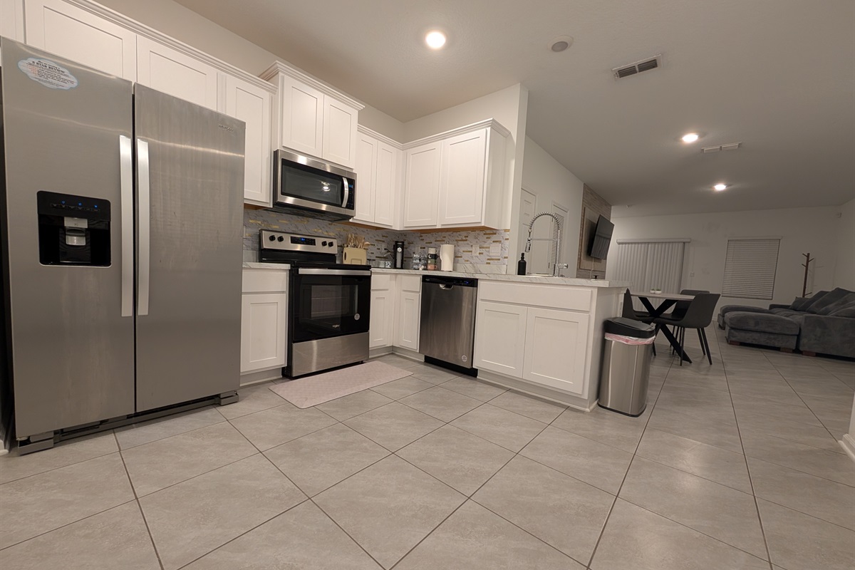 Full kitchen with stove and dishwasher