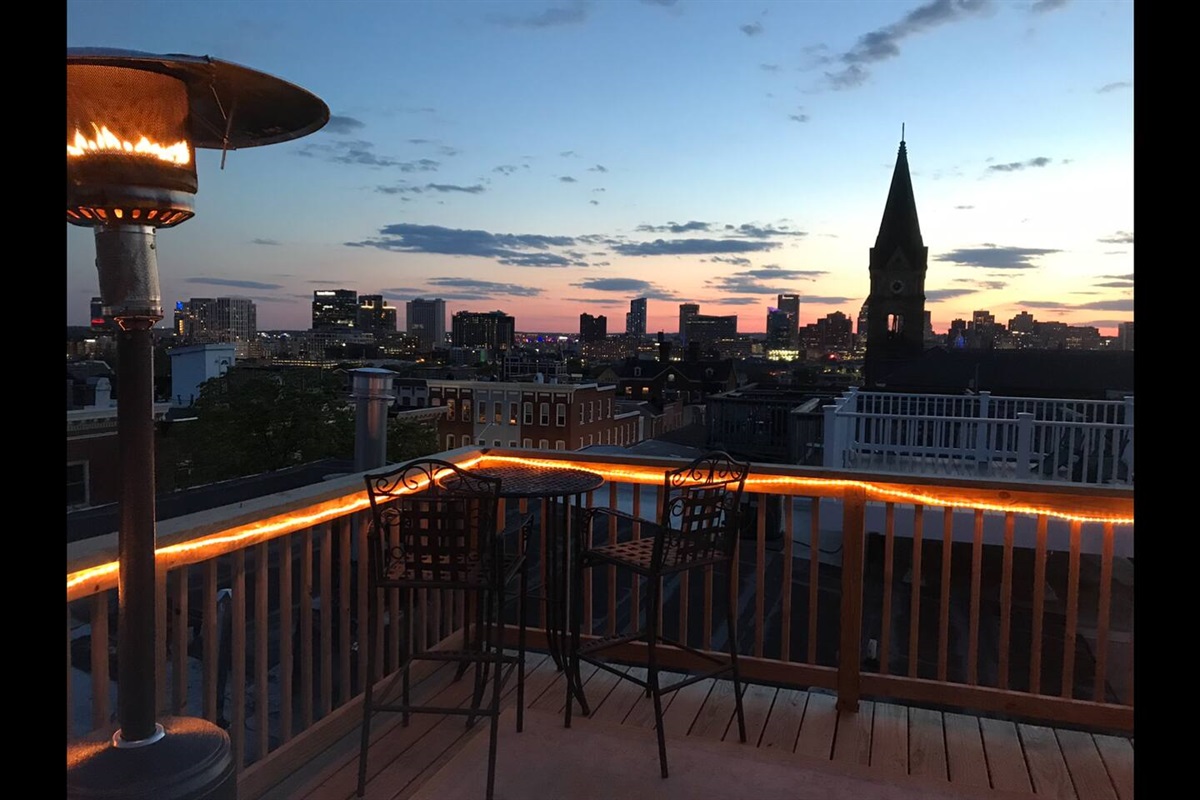 Roof top deck view of city skyline, Baltimore harbor and other local attractions