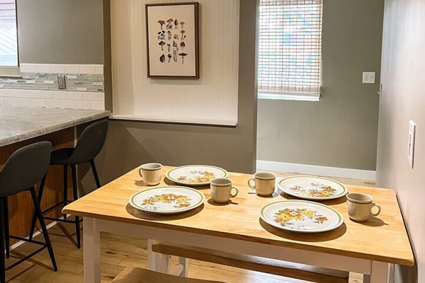 Dining table seats four and an additional two can sit at the counter.