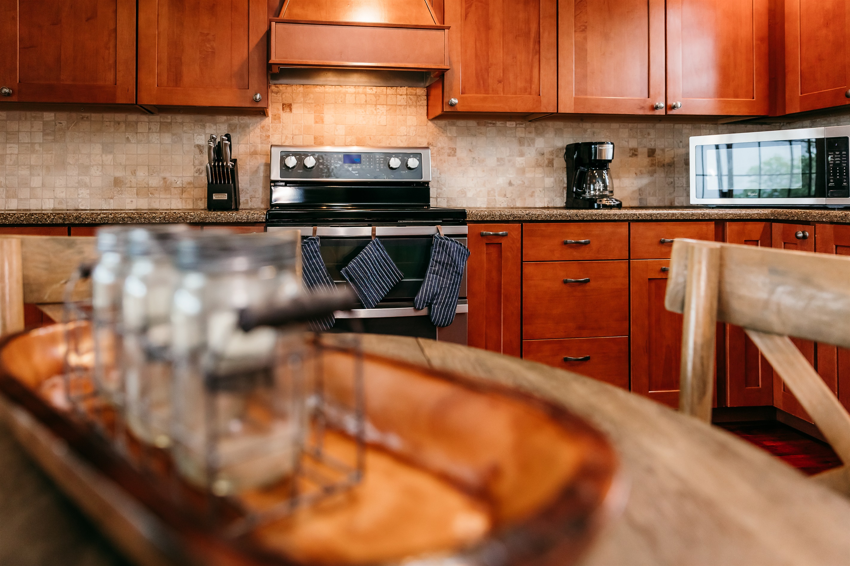 kitchen with double ovens and microwave