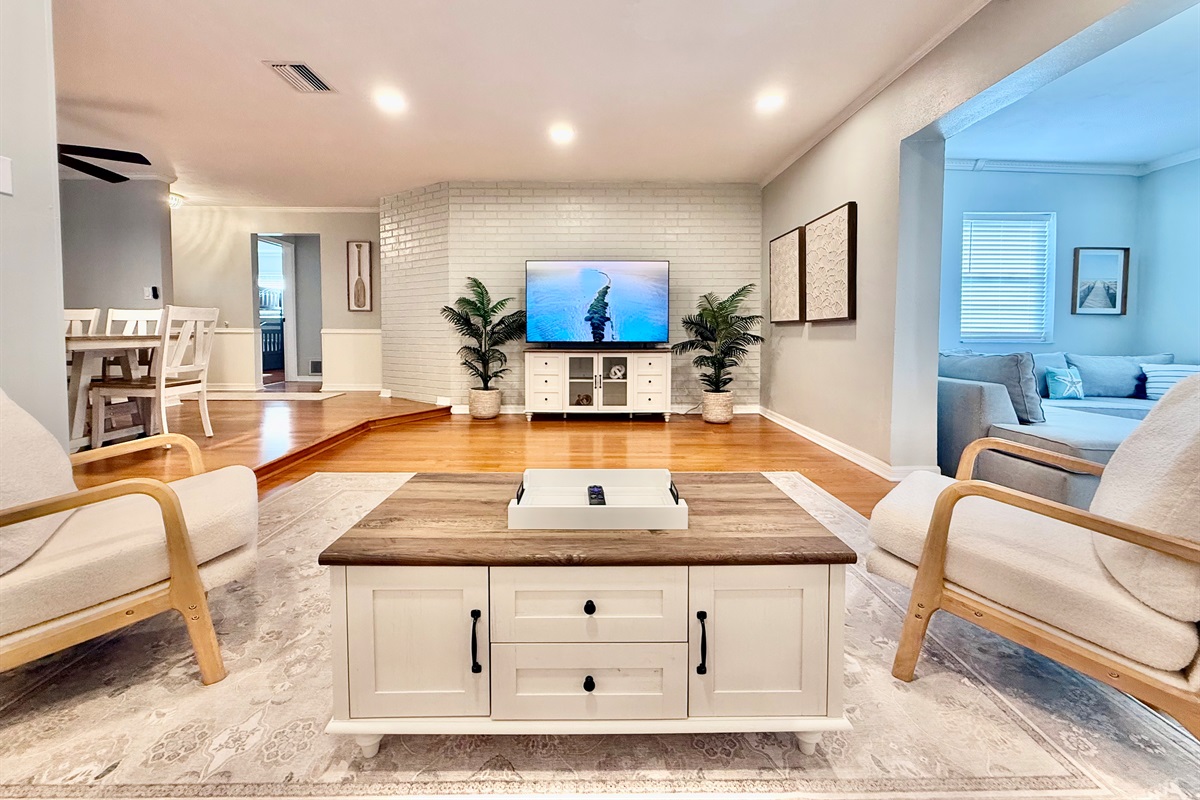 Natural light, warm floors, and cozy seating create a bright and welcoming spot to read, nap, or chat with friends.