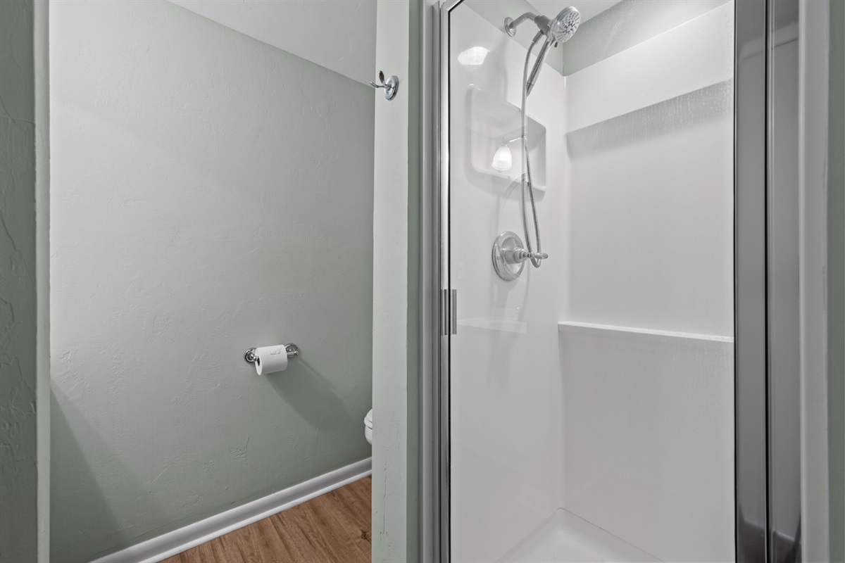 Full guest bathroom with walk-in shower and clean modern finishes