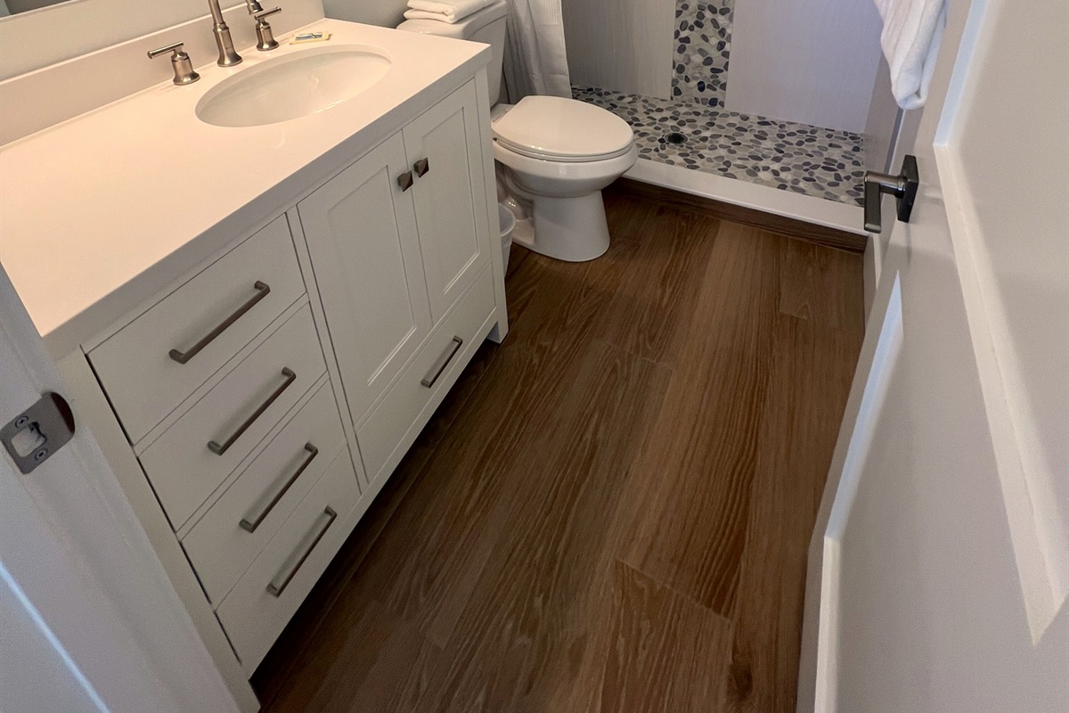 New master bath ensuite with walk in shower. 