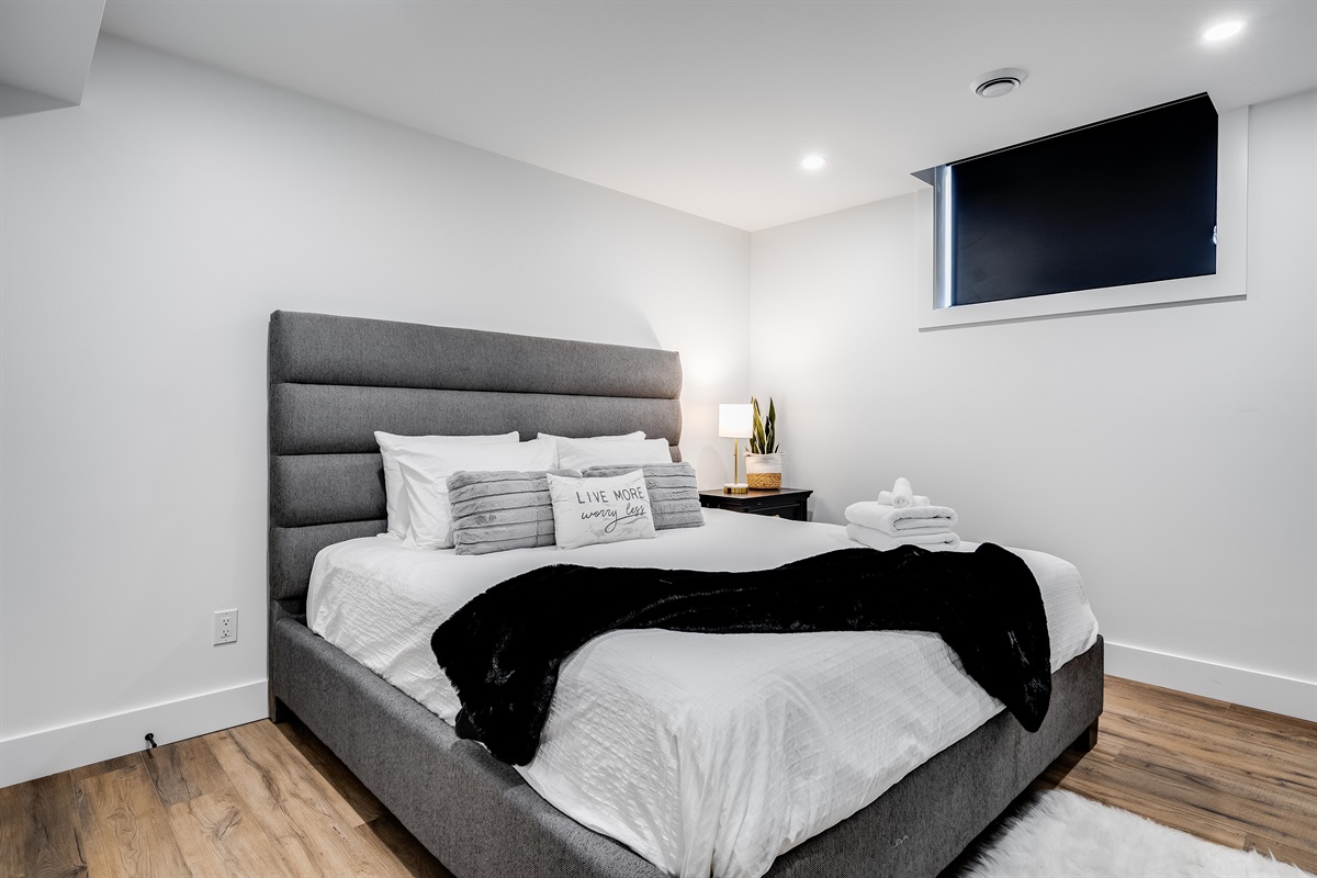 King Bedroom with Subtle wood textures enhance modern elegance.