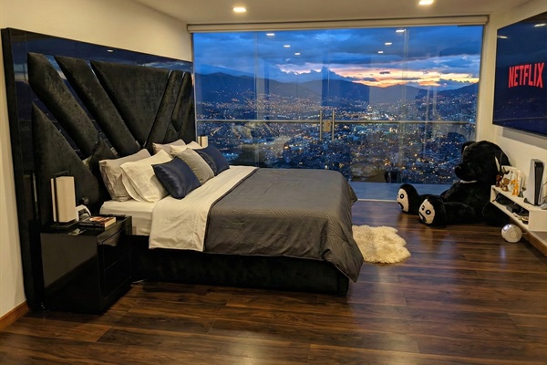 Room #1 - the master! King size bed, 85" TV, automatic blinds, 2 balconys (pool and city view), walk in closet, double sink bathroom