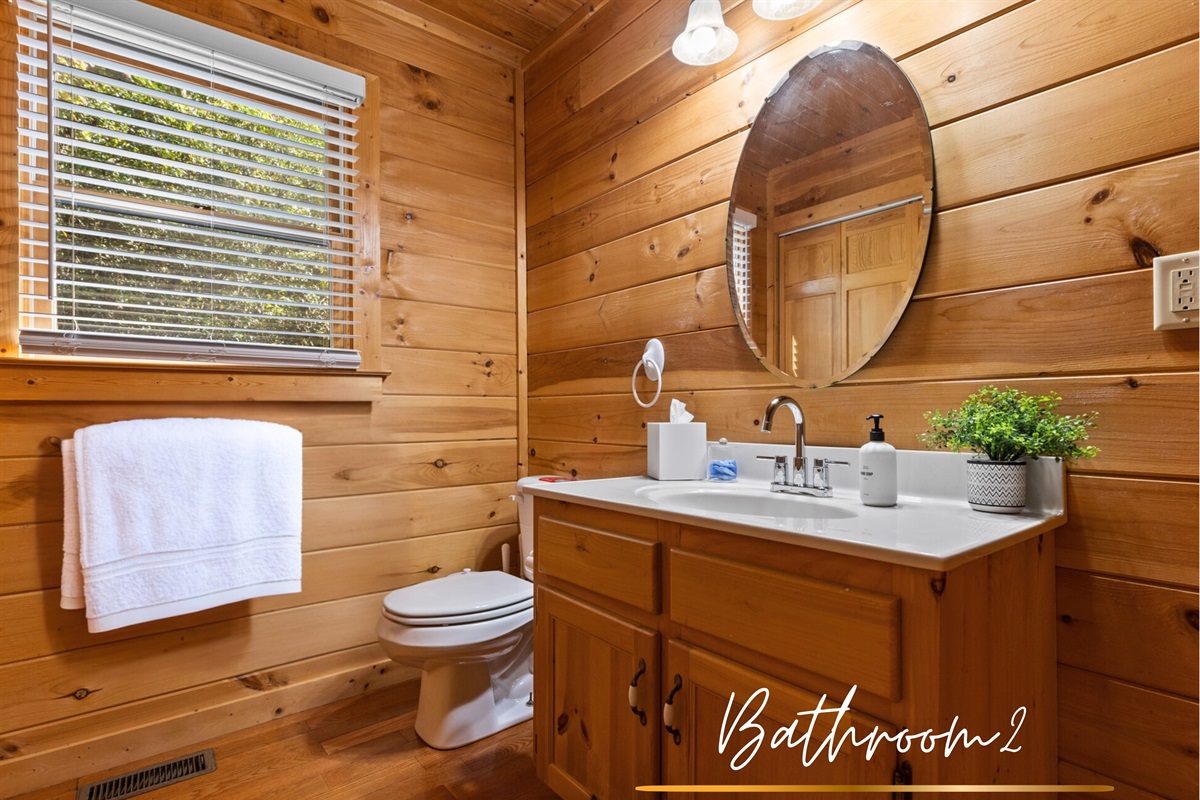 This bathroom blends forest vibes with everyday luxury.