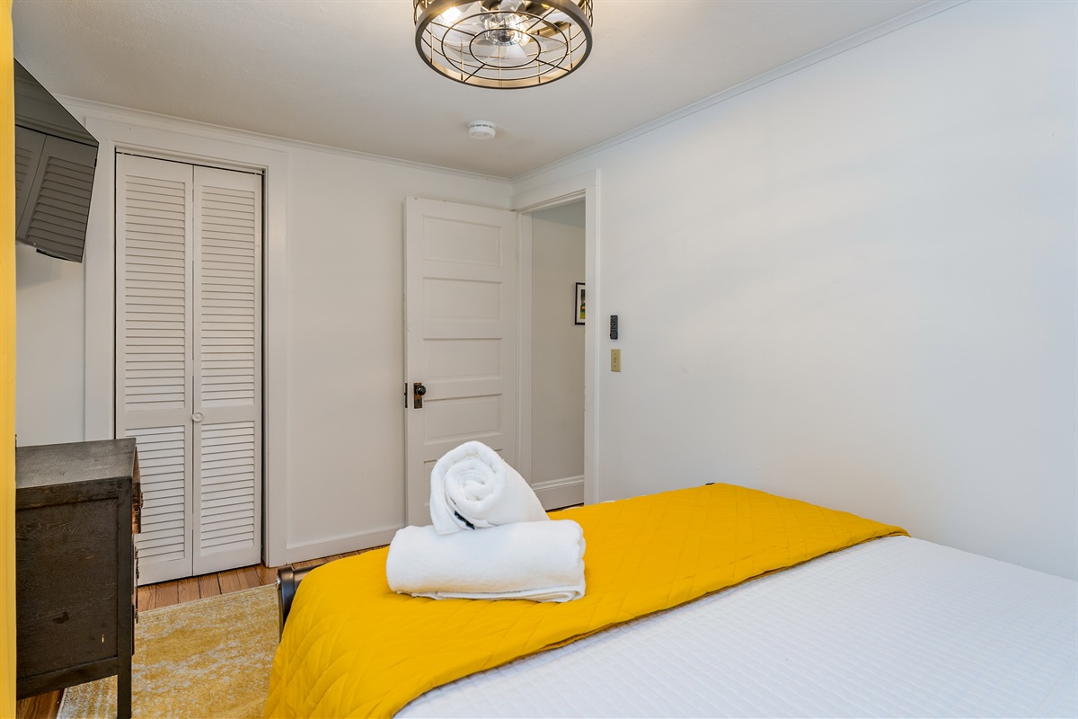 Enjoy restful nights in this cheerful queen bedroom with stylish lighting, ample closet space, and a clean, airy vibe for ultimate comfort. Bedroom #2 upstairs