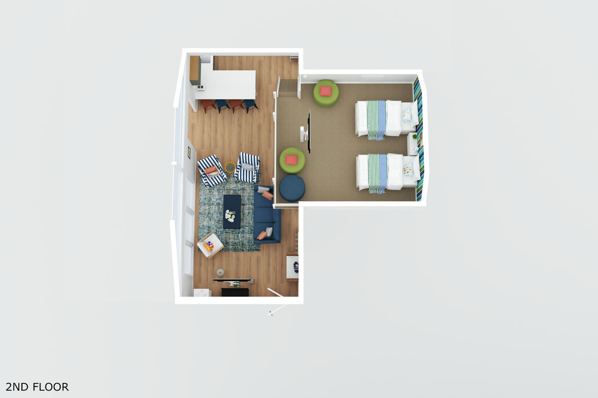 Upper loft area with two twin beds overlooking living & kitchen area below