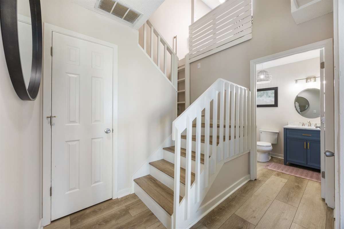 Head upstairs to find the king bedroom, guest room, and full bathrooms.