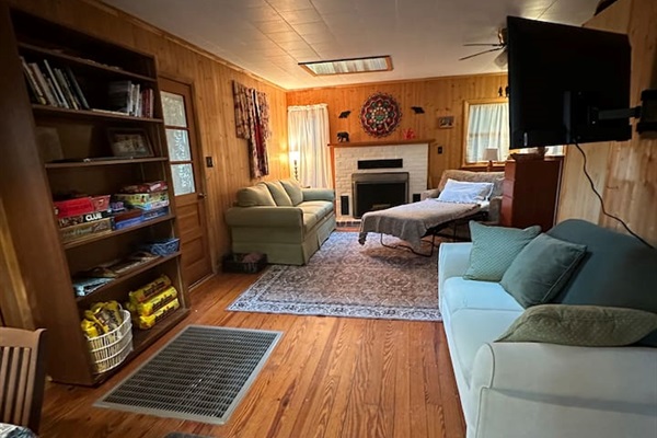 Cozy living room with two sleeper sofas — one folds into a twin bed, the other a cot-size. Perfect for extra guests! Fresh bedding is stored in the closet. Ideal for relaxing after a day exploring the orchards, trails, or lakes nearby.
