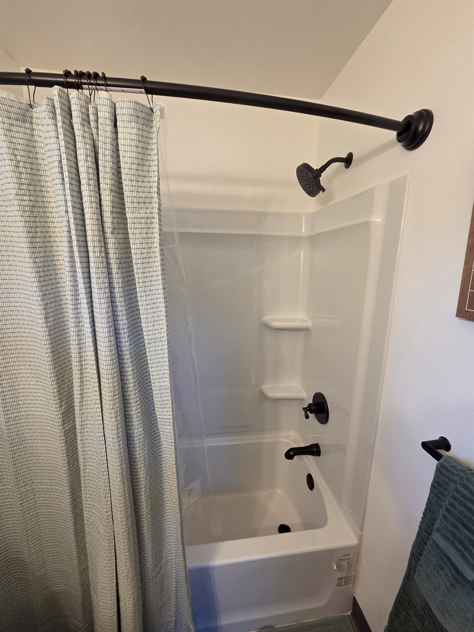 Bathroom includes vanity, toilet, and shower/tub combo.