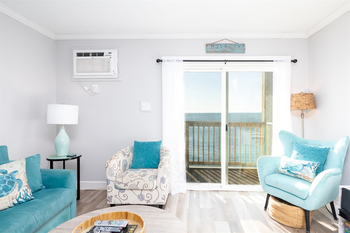 Living room with sliding window access to the balcony