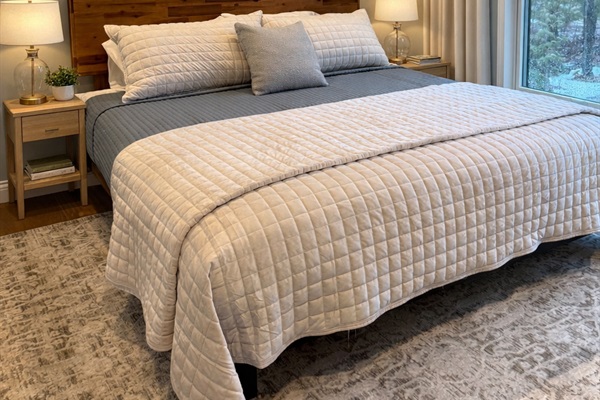 Enjoy the 2nd king bedroom on the main floor with ceiling fan and black-out drapes.