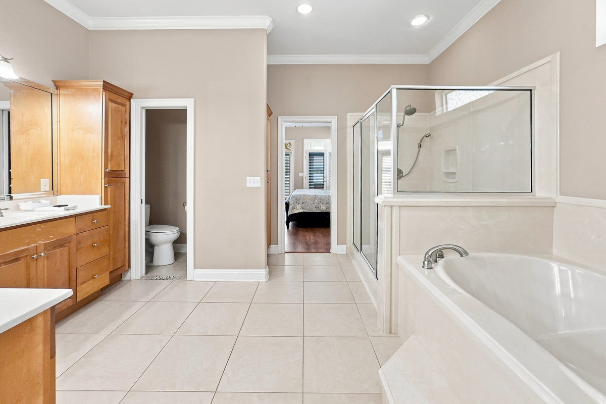 Full bathroom with vanity and a relaxing soaking tub