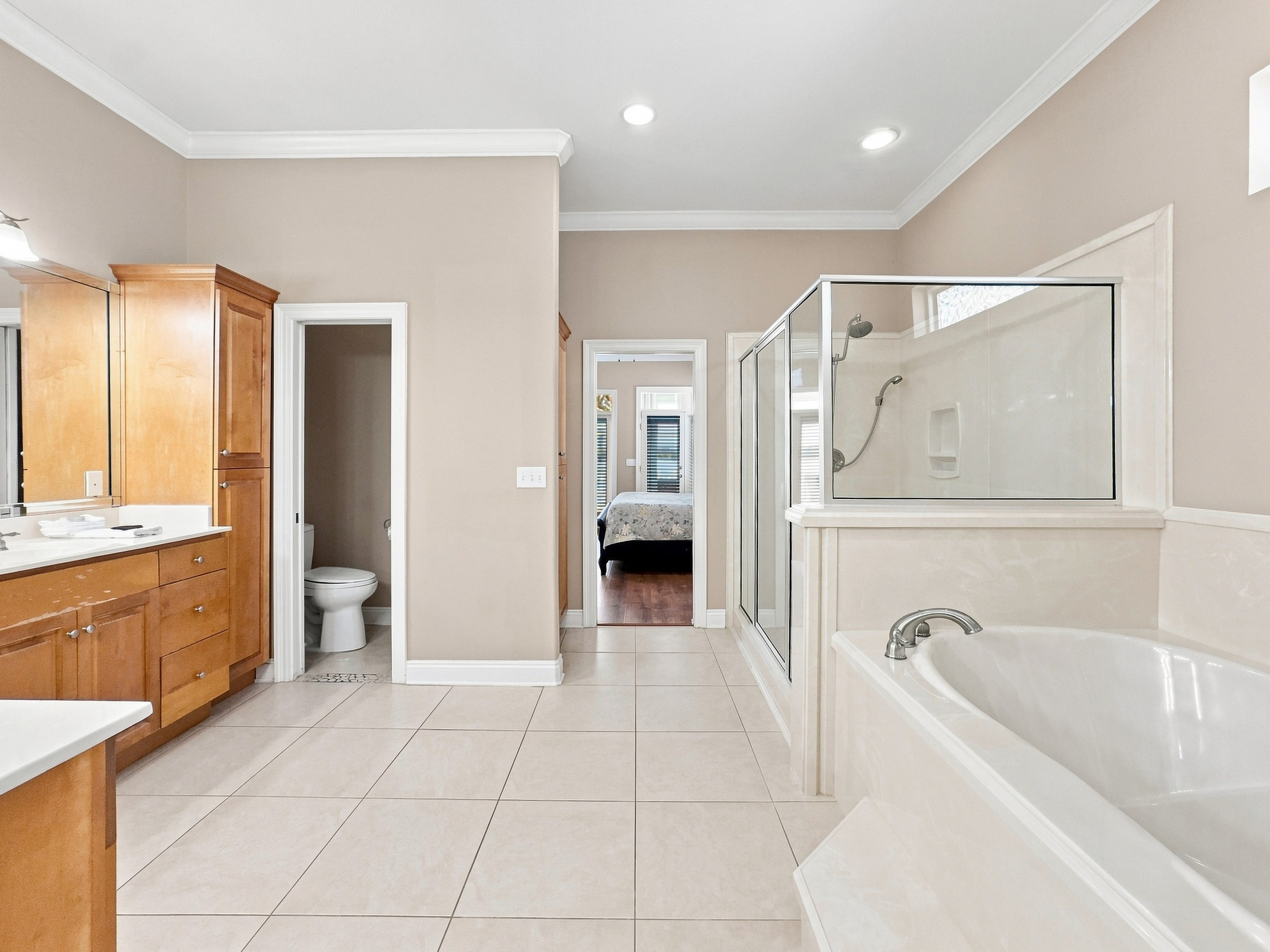 Full bathroom with vanity and a relaxing soaking tub