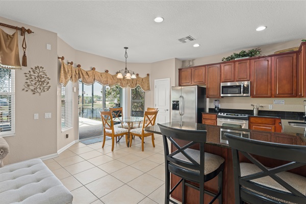 Kitchen w/ Breakfast Nook Overlooking Pool