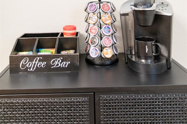 Keurig coffee maker, and coffee capsules.