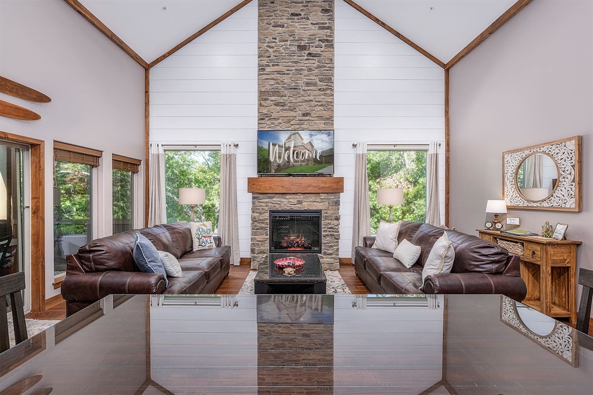 Big Great Room overlooks nature trail and creek and leads to screened in deck.