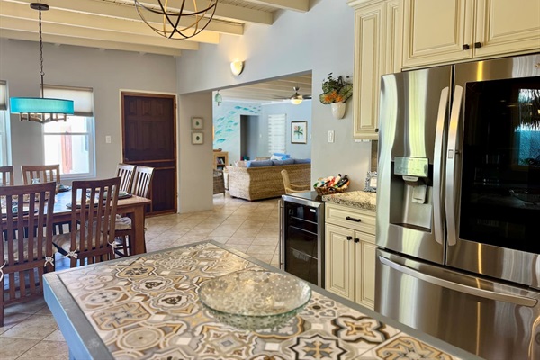 Full Sized Kitchen with full sized refrigerator and wine refrigerator.
