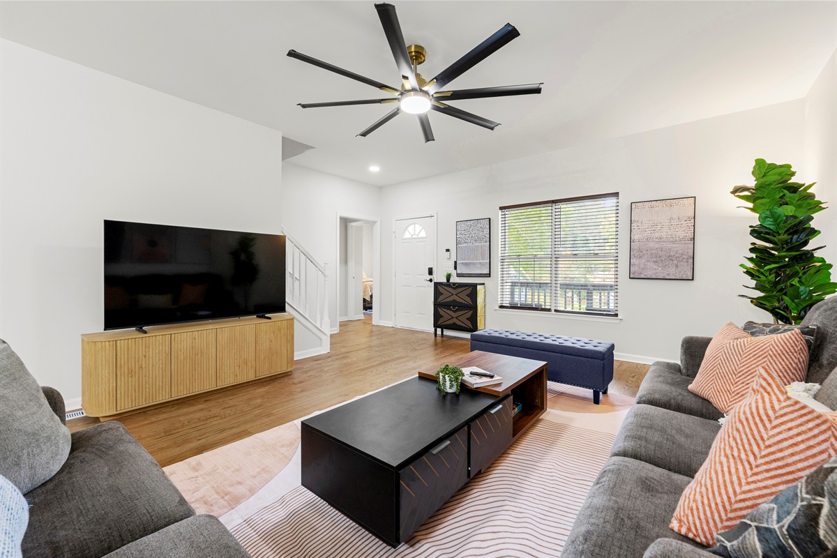 Gather everyone in this open and inviting living space designed for comfort and connection.
