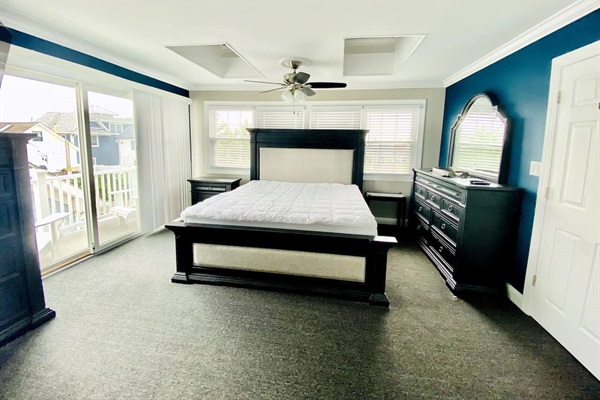 Master bedroom with balcony and en-suite bathroom. 2 skylights, windows and sliding door provide plenty of natural light.