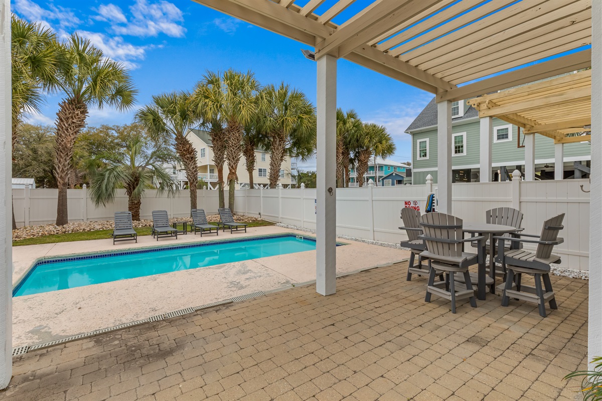 The setting below the main level primary suite balcony.