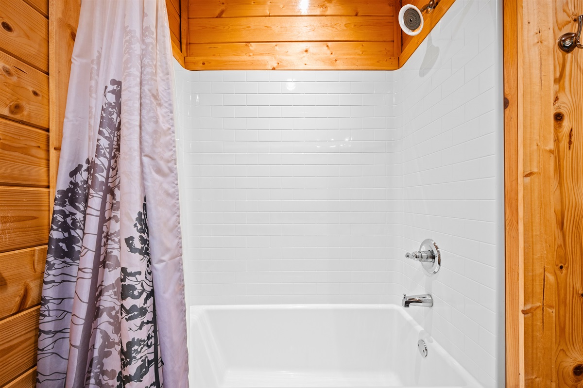 The shower area is bright and functional, making it easy to start your day feeling refreshed.