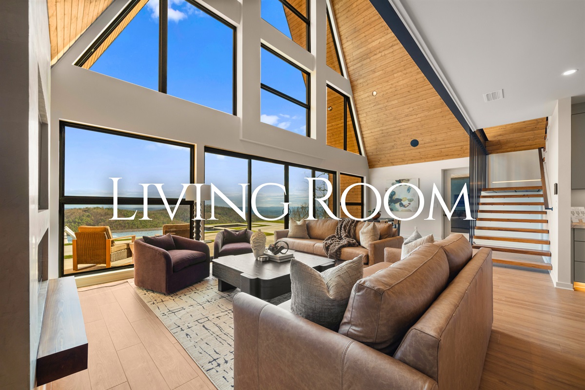 Kick back in the living room where plush seating, high ceilings, and those gorgeous windows create the perfect space for movie nights, naps, and relaxing together.