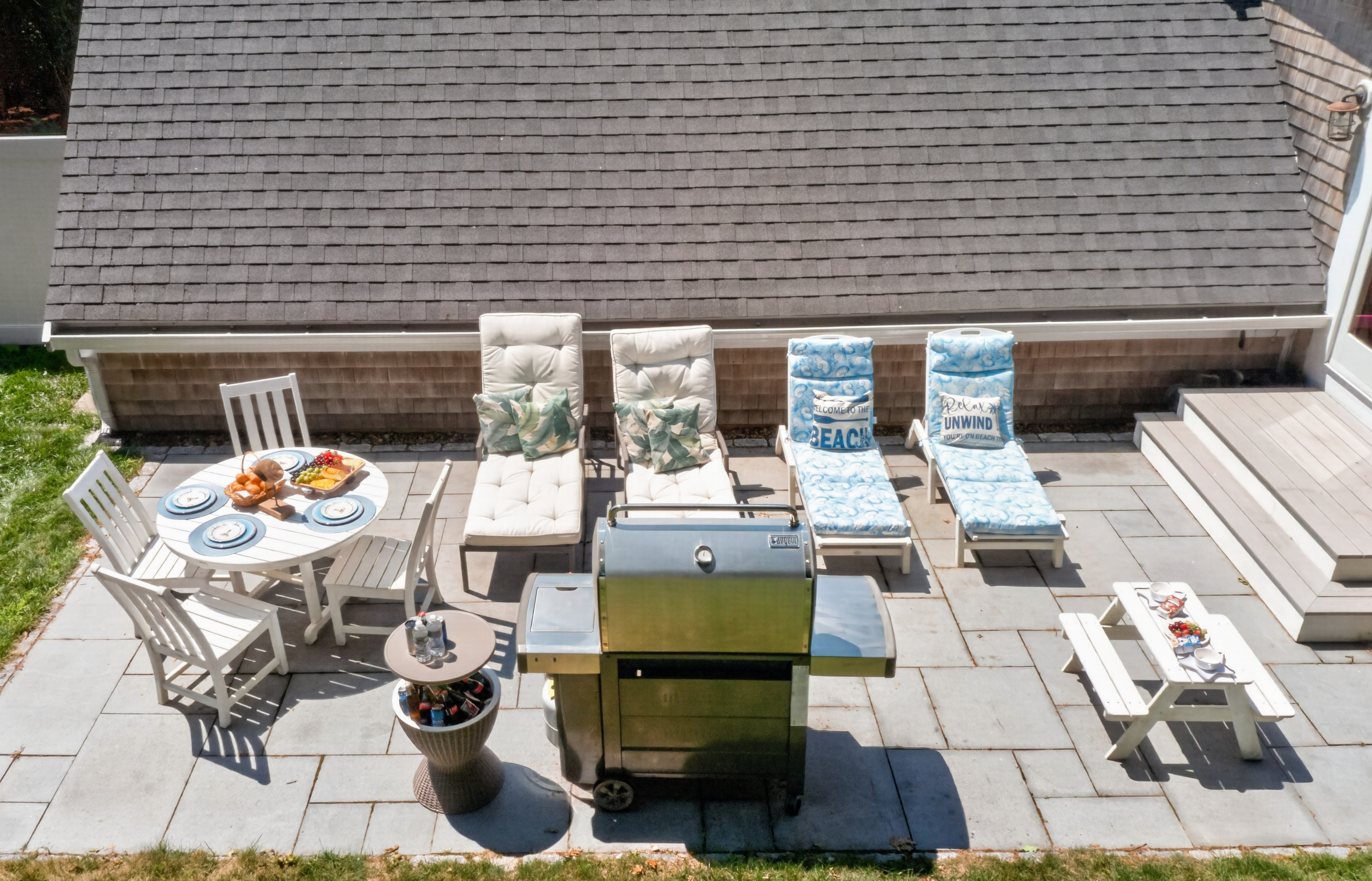 Private patio with outdoor dining, lounge seating, and a BBQ for effortless cookouts.
