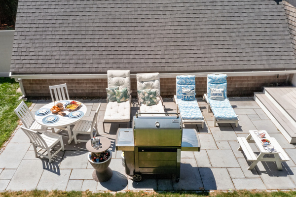 Private patio with outdoor dining, lounge seating, and a BBQ for effortless cookouts.