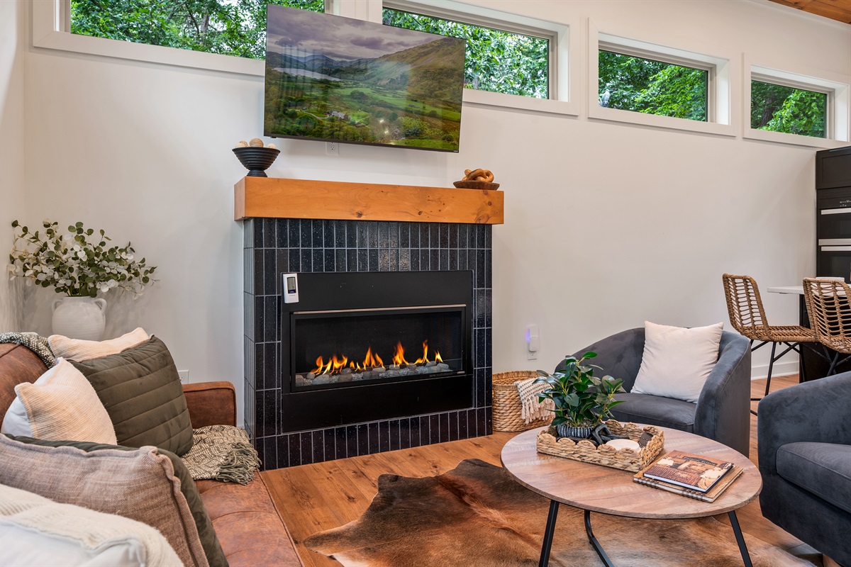 Open layout with spiral staircase and vaulted ceilings - cabin-in-the-trees vibe without feeling rustic or dated, built 2025 with all modern amenities. 