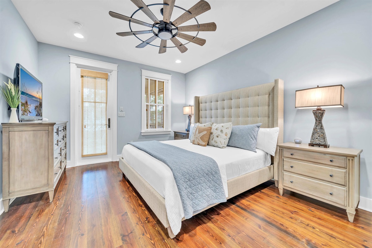 Upstairs master suite with tranquil views and soft linens.