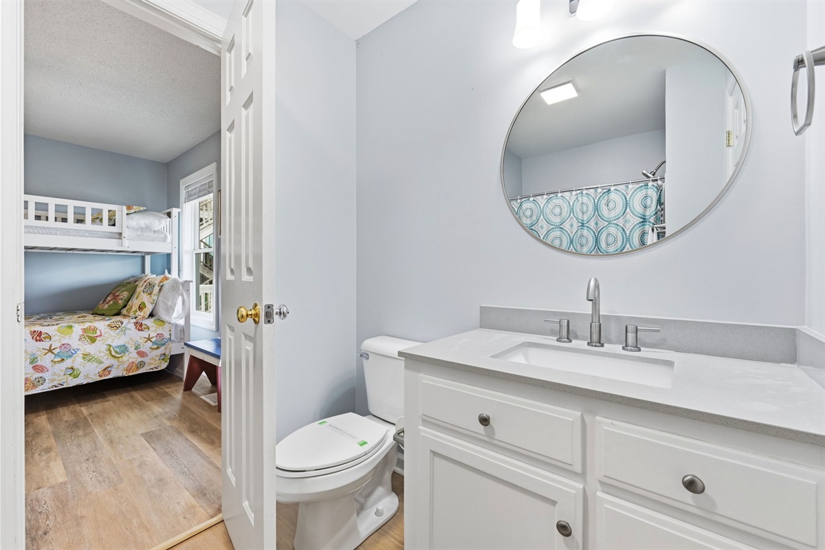 Smart layout connecting bunk rooms with a shared Jack and Jill bath
