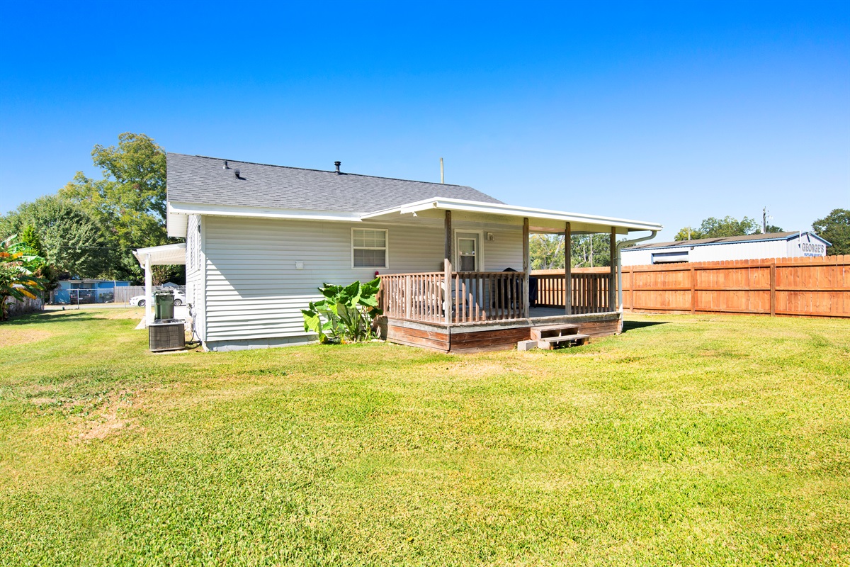 Back porch with grill and seating.