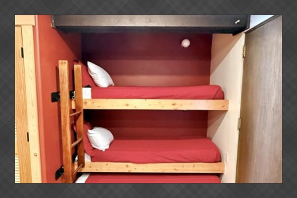 Bedroom: Twin bunkbeds, 1 twin bed under bottom bunk. 