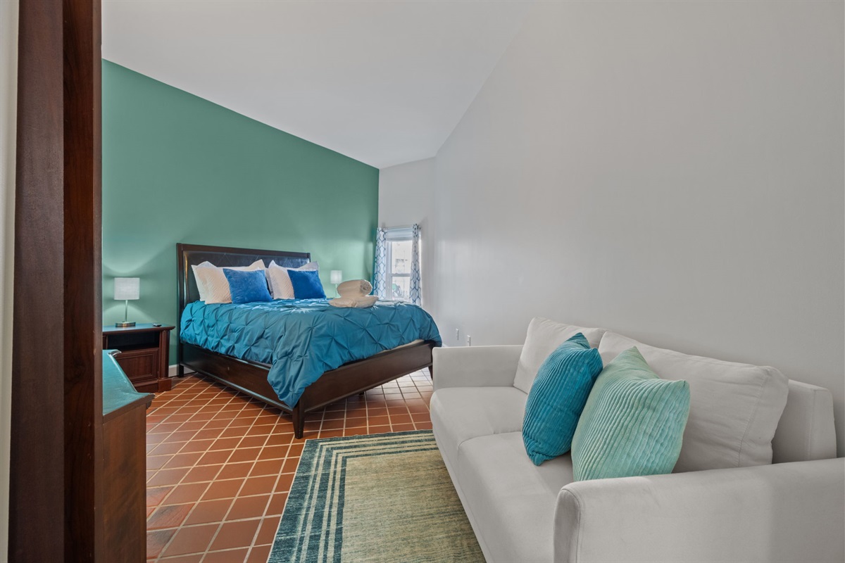 Calm 2nd bedroom with a Queen bed and cozy seating