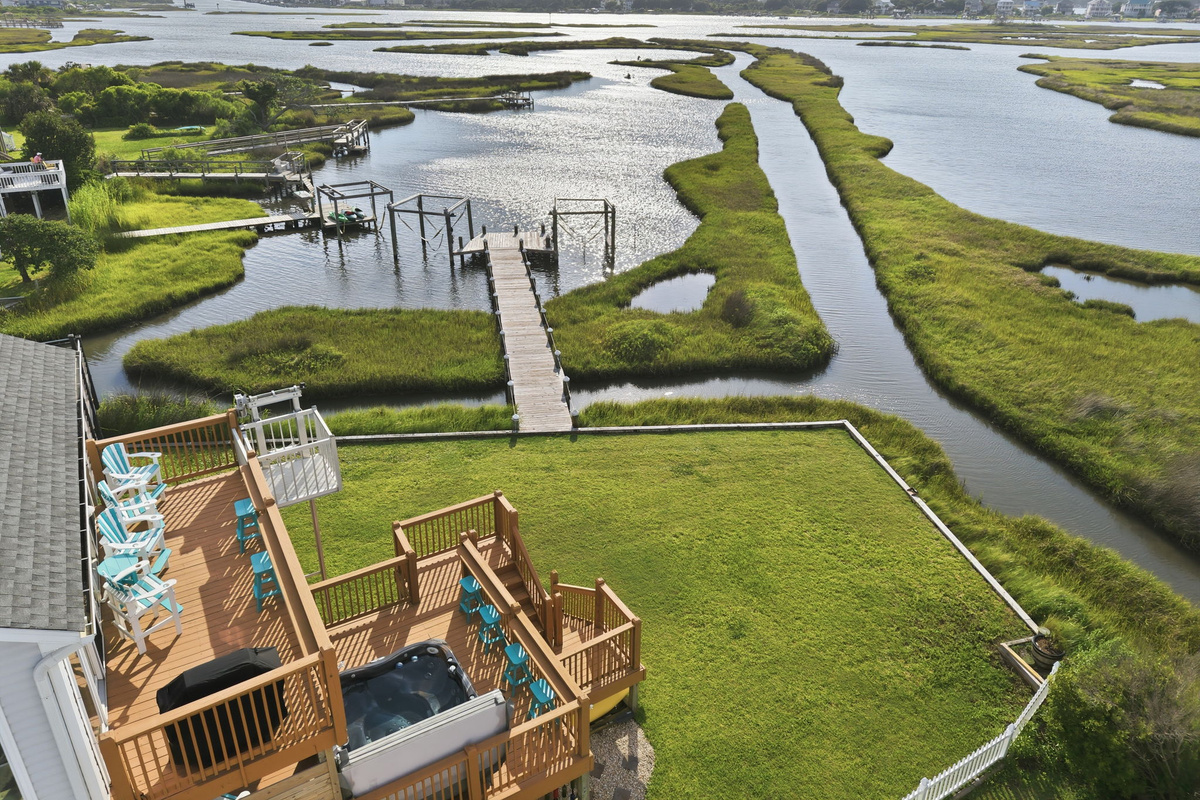 The back deck is the perfect spot to enjoy the sights, sounds, and serenity of the water. 