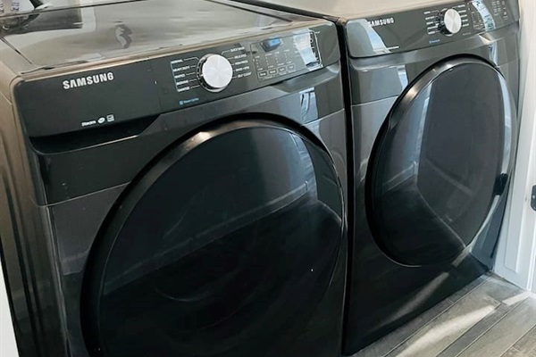 Steam washer and dryer, with laundry pods available. 