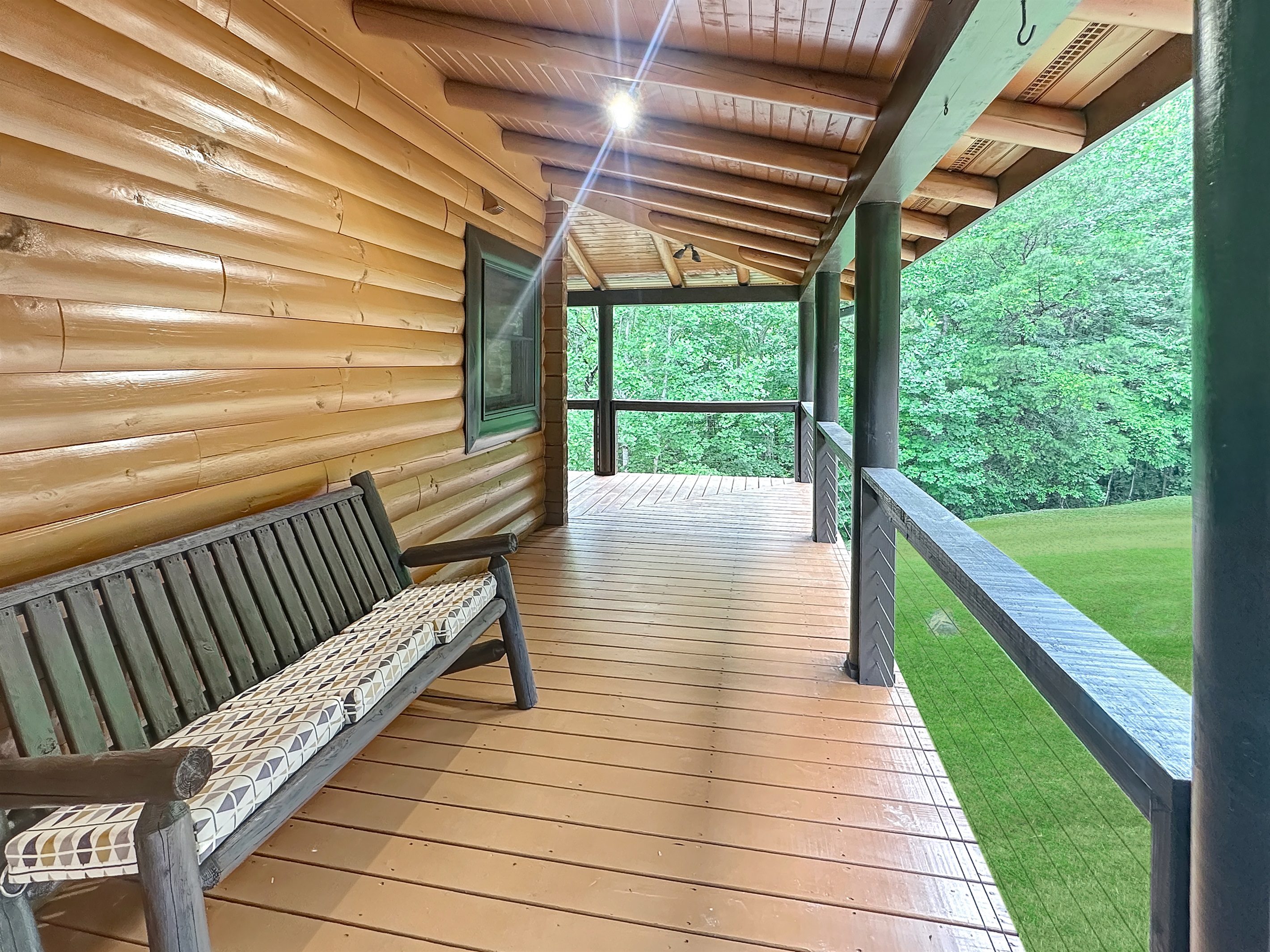 Porch: Unwind on the spacious porch with serene views of lush greenery!
