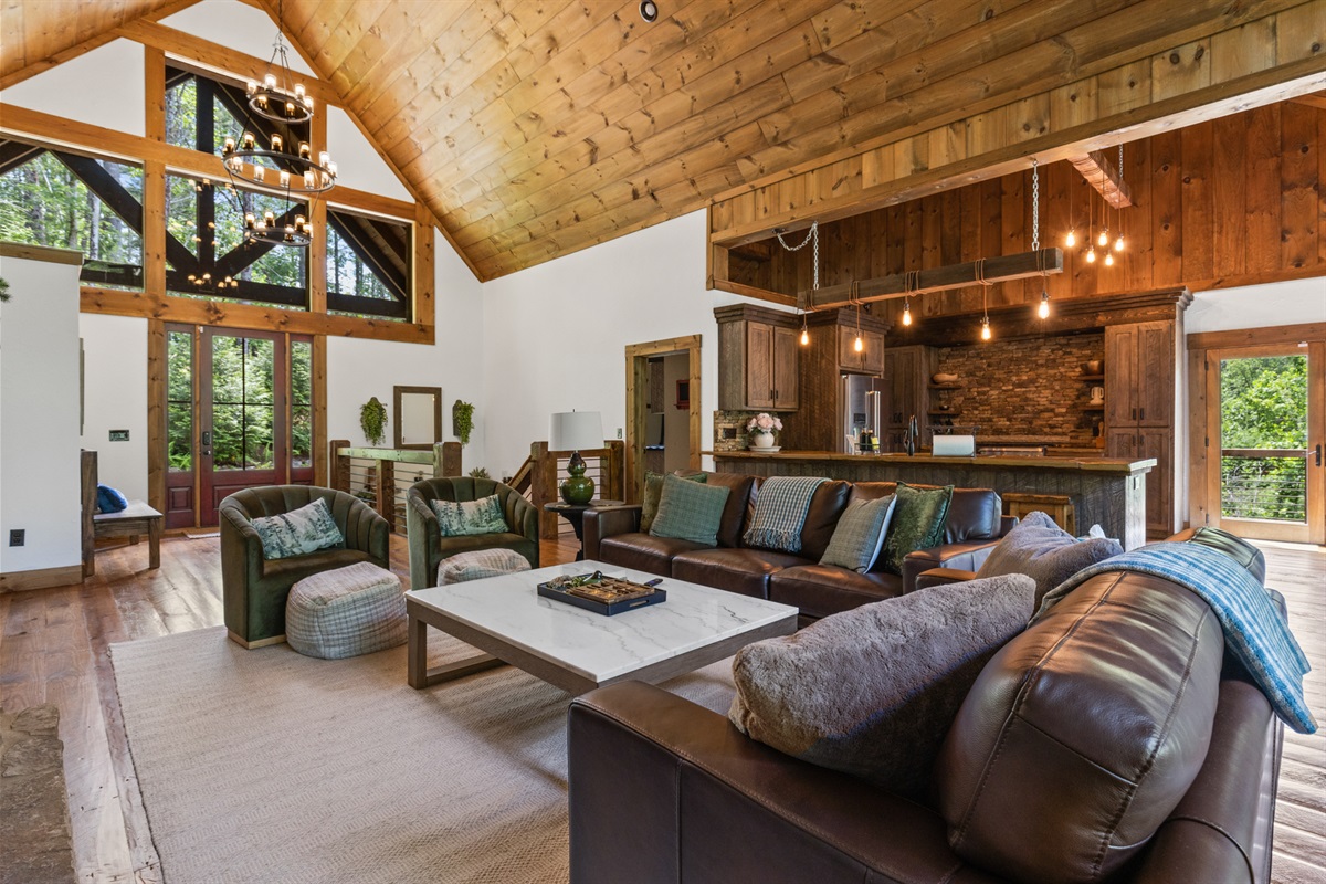 With its vaulted ceilings and warm wood accents, this living room is an inviting space to gather morning, noon, or night.