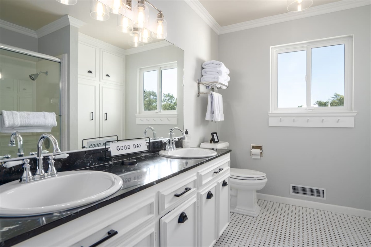 Enjoy the convenience of a shared bathroom with dual sinks.
