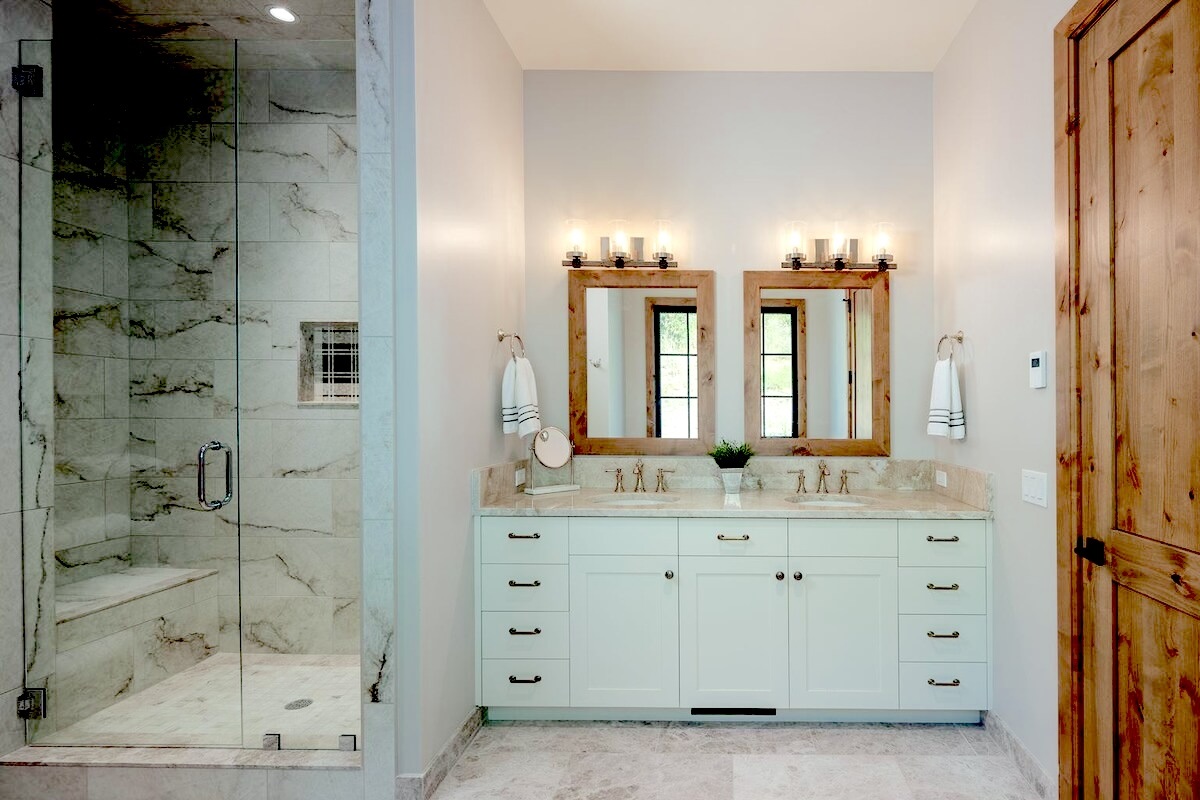 BR 1- En Suite Bath with glass enclosed shower and dual vanities