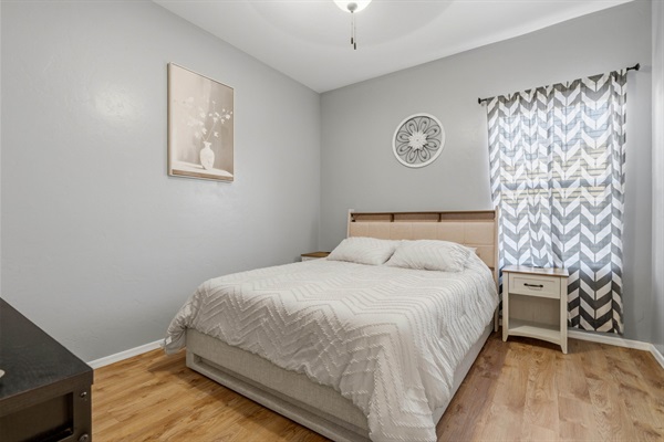 Queen Bed with 2 nightstands and Smart TV